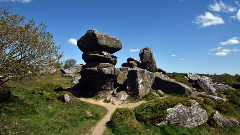Stacked rock formation at Brimham Rocks, with blue sky above